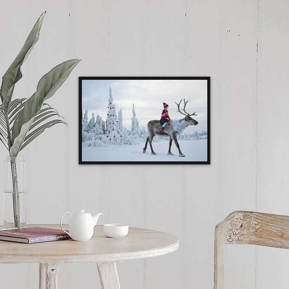 "A girl riding a reindeer through a winter forest" Black Float Frame Canvas Art