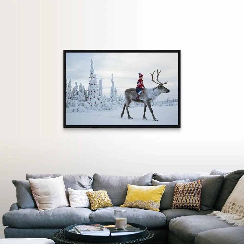 "A girl riding a reindeer through a winter forest" Black Float Frame Canvas Art