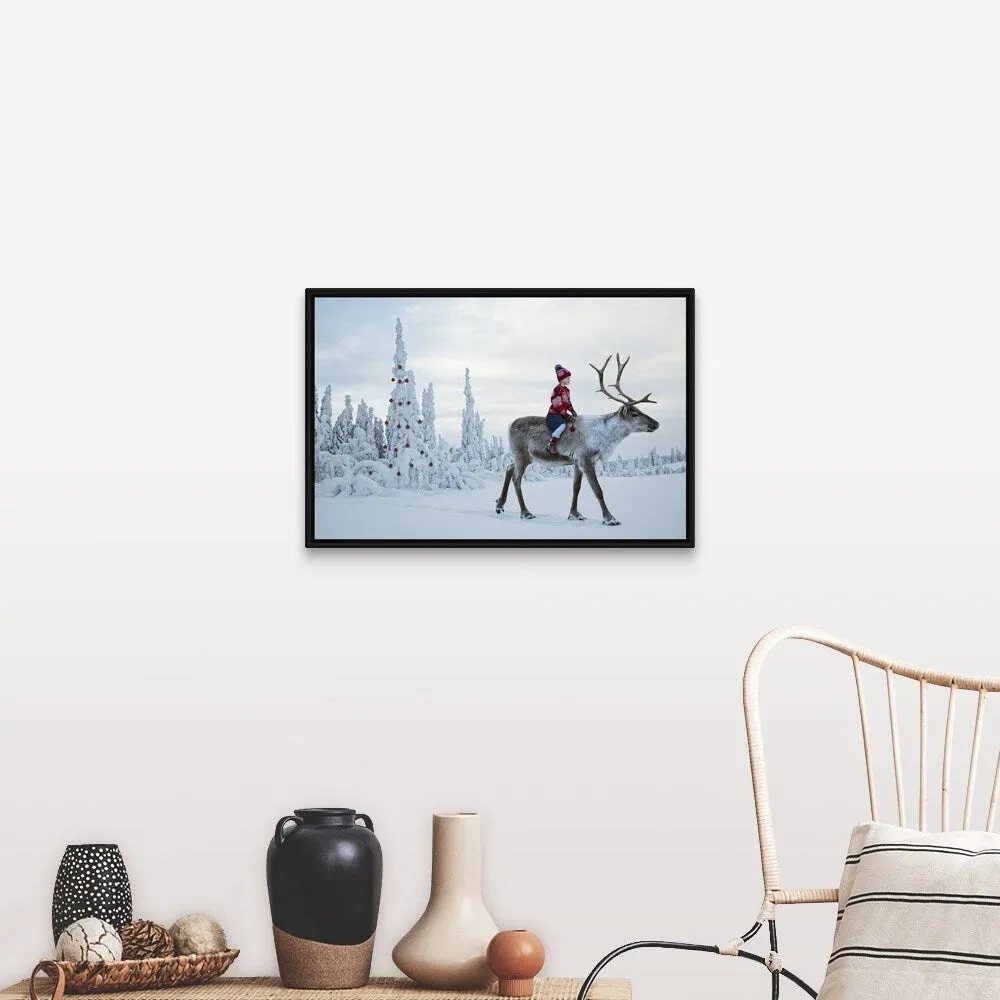 "A girl riding a reindeer through a winter forest" Black Float Frame Canvas Art