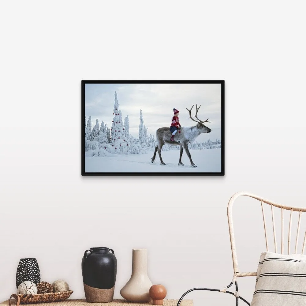 "A girl riding a reindeer through a winter forest" Black Float Frame Canvas Art