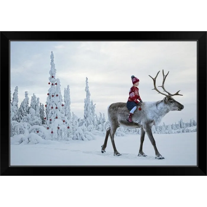 "A girl riding a reindeer through a winter forest" Black Framed Print