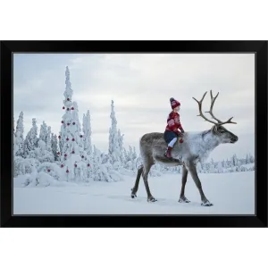 "A girl riding a reindeer through a winter forest" Black Framed Print